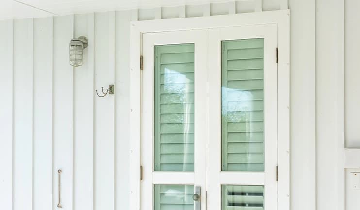 Replacement windows with white trim.