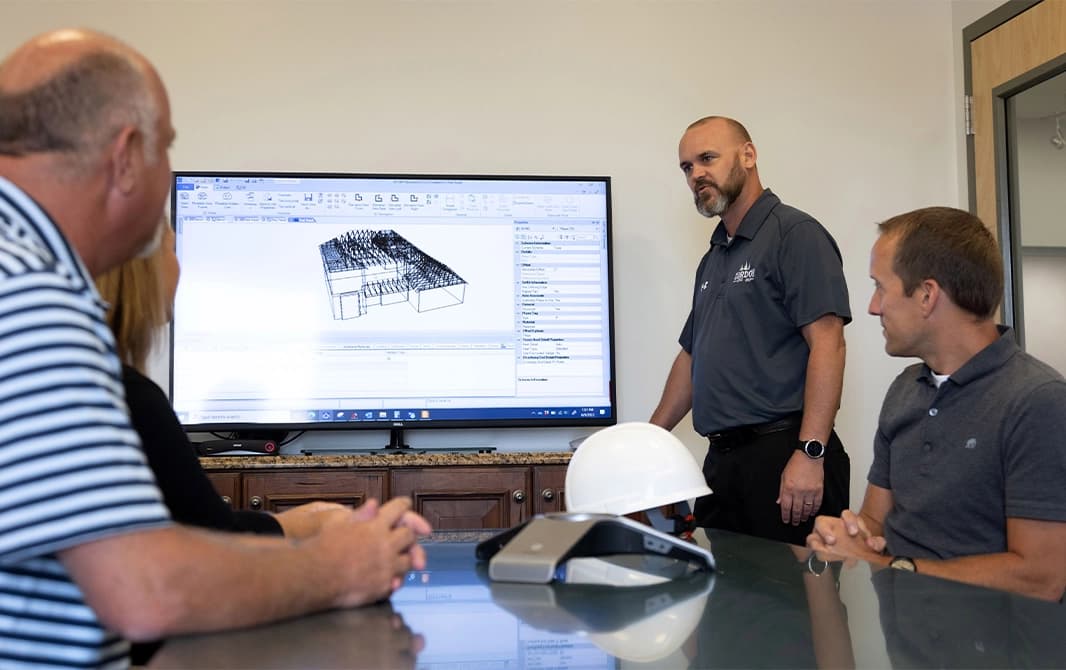 Group of contractors meeting about a home building project.