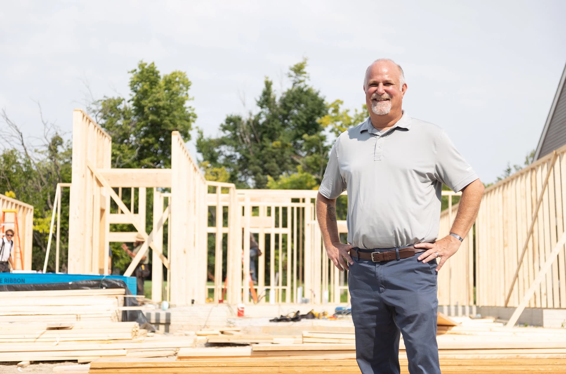 Contractor standing on a residential building site.