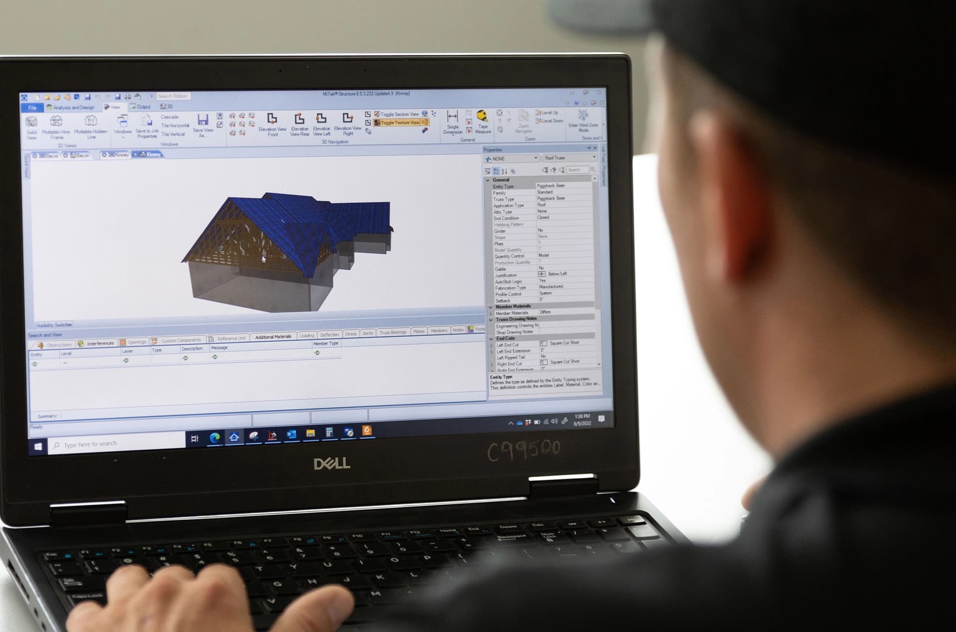 Computer screen with 3d rendering of a construction site.