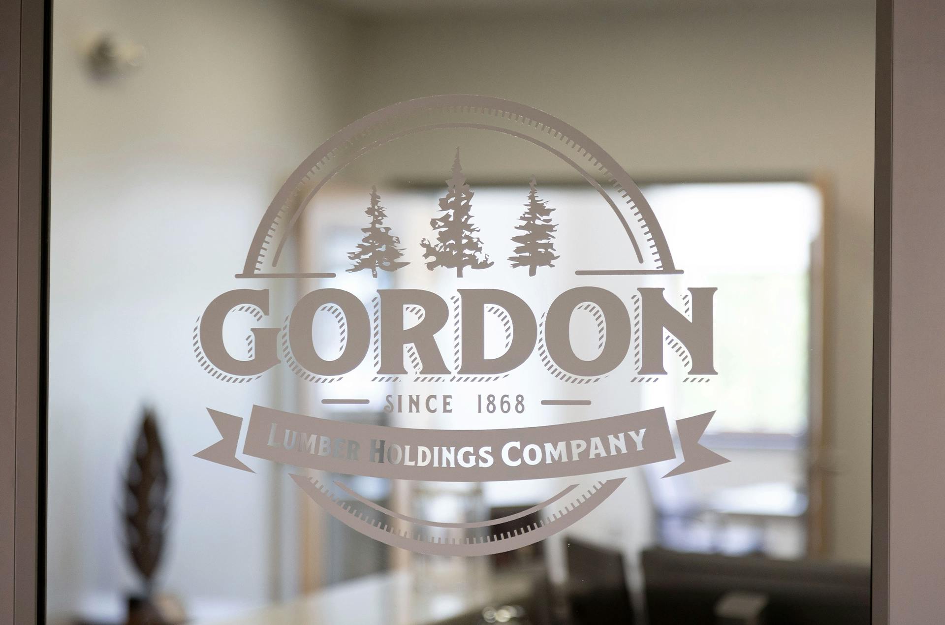 Gordon Lumber logo printed on a glass door.